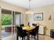 Bright dining area with table and chairs near kitchen and access to patio at 4489 Strathmore Dr, Lake Wales, FL 33859