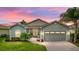 Attractive single-story home with a two-car garage and landscaped yard at 4489 Strathmore Dr, Lake Wales, FL 33859