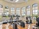 Fitness center with various equipment and lake views at 4489 Strathmore Dr, Lake Wales, FL 33859