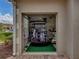 Garage with golf cart, clubs, and storage at 4489 Strathmore Dr, Lake Wales, FL 33859