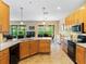 Modern kitchen with island, stainless steel appliances, and ample cabinet space at 4489 Strathmore Dr, Lake Wales, FL 33859