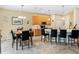 Modern kitchen with light wood cabinets and a large island with seating at 4489 Strathmore Dr, Lake Wales, FL 33859