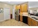 Spacious kitchen with light wood cabinets, stainless steel appliances, and granite countertops at 4489 Strathmore Dr, Lake Wales, FL 33859
