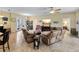 Spacious living room with leather sofas, a large TV, and tile flooring at 4489 Strathmore Dr, Lake Wales, FL 33859