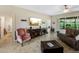 Living room with a large TV, comfortable seating and view into bathroom at 4489 Strathmore Dr, Lake Wales, FL 33859