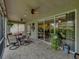 Bright, spacious lanai with access to backyard and plenty of seating at 4489 Strathmore Dr, Lake Wales, FL 33859