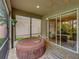 Relax in this screened lanai with hot tub, perfect for enjoying Florida evenings at 4489 Strathmore Dr, Lake Wales, FL 33859