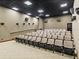 Community theater with tiered seating and projector at 4489 Strathmore Dr, Lake Wales, FL 33859