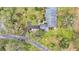 Aerial view showcasing home, landscaping, and driveway at 48 Nottingham Way, Haines City, FL 33844