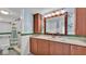 Clean bathroom, featuring a large vanity and updated fixtures at 48 Nottingham Way, Haines City, FL 33844