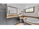 Bathroom with granite vanity, large soaking tub, and walk-in shower at 48 Nottingham Way, Haines City, FL 33844