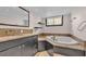 Bathroom features granite countertops, a soaking tub, and a large mirror at 48 Nottingham Way, Haines City, FL 33844