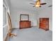 Bright bedroom featuring wood furniture and gray carpeting at 48 Nottingham Way, Haines City, FL 33844