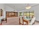 Bright dining area with built-in shelving and view to backyard at 48 Nottingham Way, Haines City, FL 33844