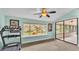 Bright room with a treadmill and sliding glass doors at 48 Nottingham Way, Haines City, FL 33844