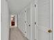 Light-filled hallway with light wood flooring and built-in storage at 48 Nottingham Way, Haines City, FL 33844