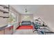 Home office with desk, couch, and large window at 48 Nottingham Way, Haines City, FL 33844