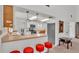 Modern kitchen with stainless steel appliances and breakfast bar at 48 Nottingham Way, Haines City, FL 33844