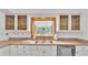 Kitchen sink and countertop with wooden window at 48 Nottingham Way, Haines City, FL 33844