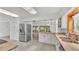 Open kitchen with stainless steel appliances and view to dining area at 48 Nottingham Way, Haines City, FL 33844