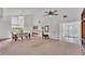 Open-concept living and dining area with access to a screened patio at 48 Nottingham Way, Haines City, FL 33844