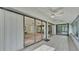 Screened porch with sliding glass doors leading to the backyard at 48 Nottingham Way, Haines City, FL 33844