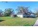 Large backyard with a screened patio and a fenced area at 5090 Misty Lake Dr, Mulberry, FL 33860