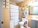 Clean bathroom with toilet, tub, and shower at 5090 Misty Lake Dr, Mulberry, FL 33860