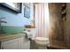 Bathroom with walk in shower, toilet, and vanity at 5090 Misty Lake Dr, Mulberry, FL 33860