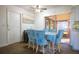 Dining area with light blue chairs and access to patio at 5090 Misty Lake Dr, Mulberry, FL 33860