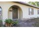 Inviting front door with arched entryway at 5090 Misty Lake Dr, Mulberry, FL 33860