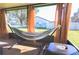 Screened porch features a relaxing hammock at 5090 Misty Lake Dr, Mulberry, FL 33860