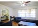 Living room with sectional sofa and wood floors at 5090 Misty Lake Dr, Mulberry, FL 33860