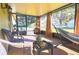 Relaxing screened porch with patio furniture and a hammock at 5090 Misty Lake Dr, Mulberry, FL 33860