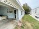 Exterior view showing the side of the house and a small yard at 50989 Highway 27 # 8, Davenport, FL 33897