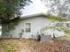 Rear view of a single story house with vinyl siding, and AC unit at 50989 Highway 27 # 8, Davenport, FL 33897