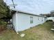 Exterior view of the house, showing the side and yard at 50989 Highway 27 # 8, Davenport, FL 33897