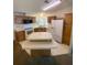 Kitchen with island and white appliances at 50989 Highway 27 # 8, Davenport, FL 33897