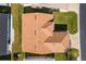 Aerial view of a house with brown roof and a yard at 515 Sweetwater Way, Haines City, FL 33844