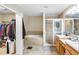 Bathroom with double vanity, garden tub, and separate shower at 523 Brookeshire Dr, Davenport, FL 33837