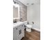 Modern bathroom with gray tile, updated vanity, and new toilet at 523 Brookeshire Dr, Davenport, FL 33837