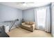 Bedroom with a loveseat, ceiling fan, and an ironing board at 523 Brookeshire Dr, Davenport, FL 33837