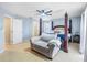 Spacious bedroom with carpeted floors, ceiling fan, and a king-size bed at 523 Brookeshire Dr, Davenport, FL 33837