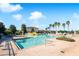 Large community pool with a water slide and surrounding patio with lounge chairs at 523 Brookeshire Dr, Davenport, FL 33837