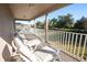Relaxing deck overlooking the backyard with lounge chairs at 523 Brookeshire Dr, Davenport, FL 33837
