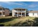 Two-story house with balcony and backyard patio at 523 Brookeshire Dr, Davenport, FL 33837