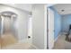 Bright hallway with carpeted floors and doors to bedrooms at 523 Brookeshire Dr, Davenport, FL 33837