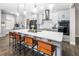Modern kitchen with gray cabinets, large island, and stainless steel appliances at 523 Brookeshire Dr, Davenport, FL 33837