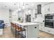 Modern kitchen with gray cabinets, large island, and stainless steel appliances at 523 Brookeshire Dr, Davenport, FL 33837
