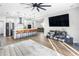 Open floor plan showing kitchen island, stainless steel appliances, and living room at 523 Brookeshire Dr, Davenport, FL 33837